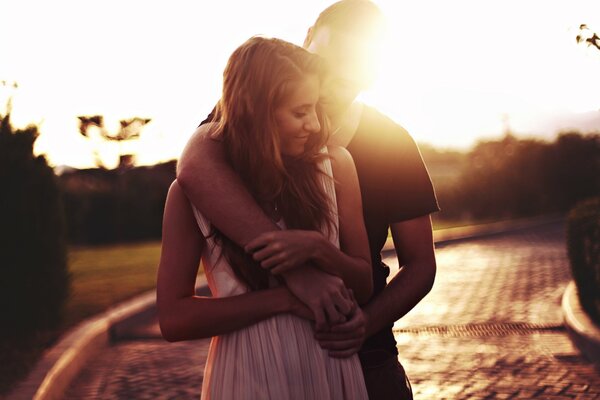 A couple in love against the sunset in the park