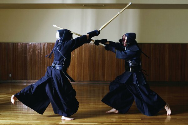 A duel between two Japanese women with bamboo swords