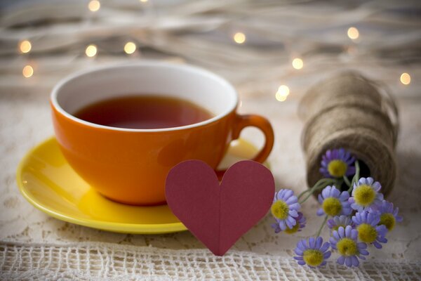 Fragrant tea and a bouquet of flowers