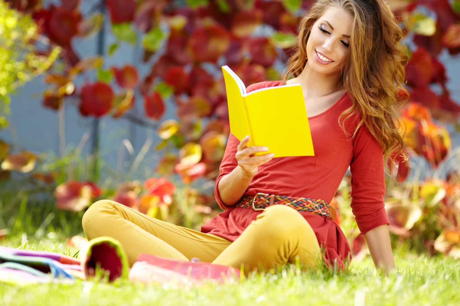 brown hair girl notebook book yellow reads autumn leaves gra