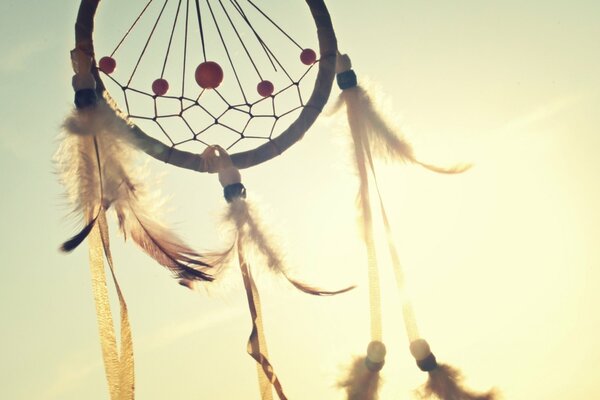 The dreamcatcher talisman hovers in the sky