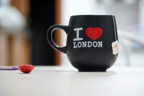 A black mug with the inscription I love London