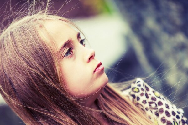 Pensive girl in the wind