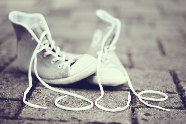 The inscription LOVE from shoelaces sneakers