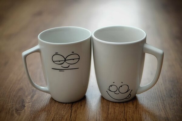 Two cups with funny faces