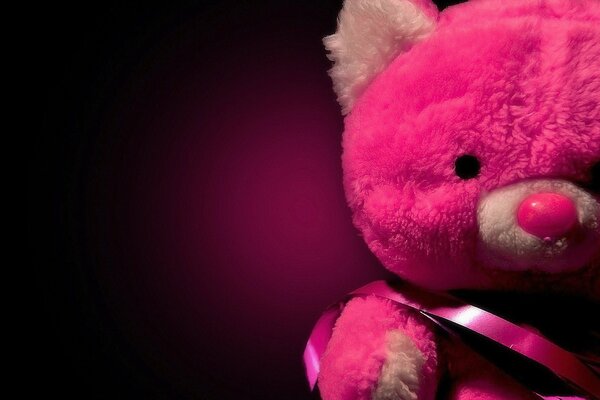 Pink teddy bear with ribbon