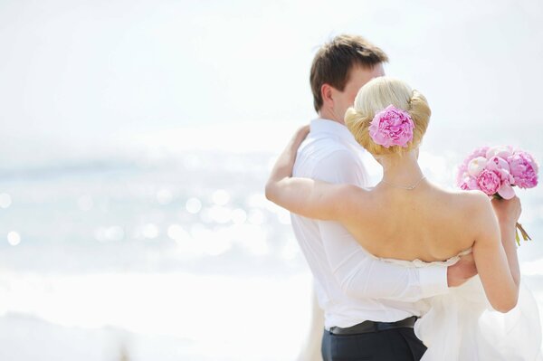 Wedding couple on the background of the sea