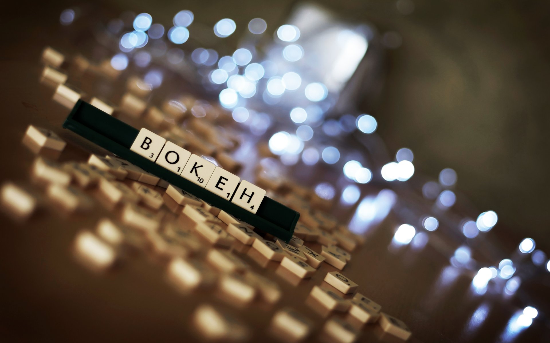 blocks randomly letters numbers game entertainment on the table bokeh light glare