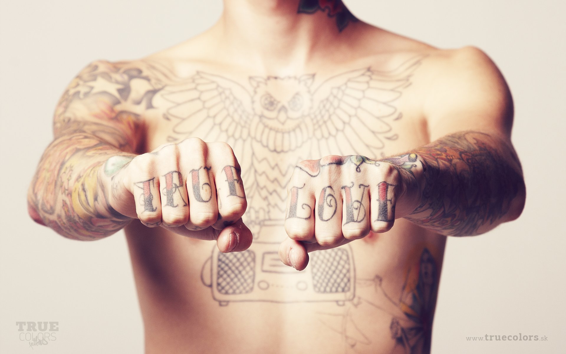 torso fists tattoo inscription true love