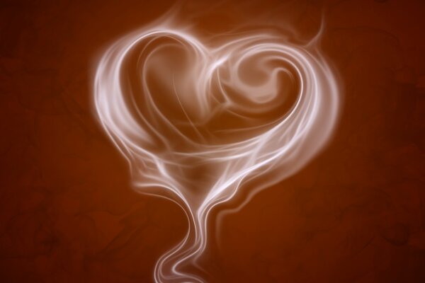 Heart of coffee on a brown background