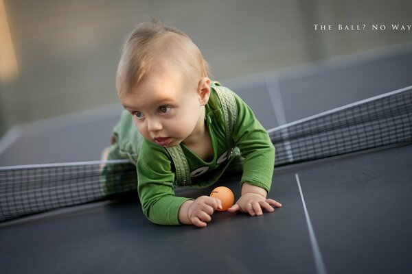 The child is lying on the table