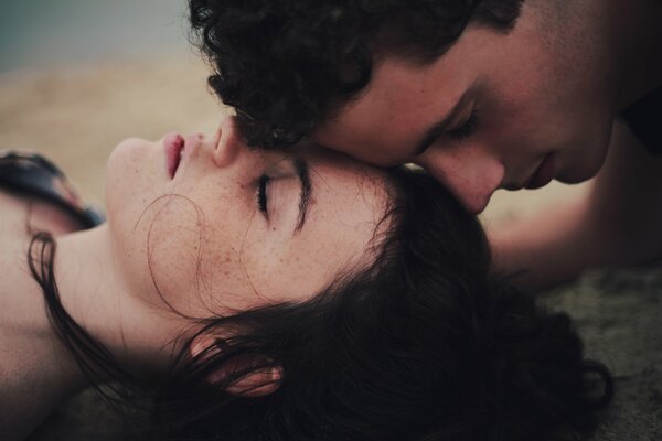 A couple on the sand. Love. Two