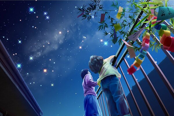 I bambini guardano le luci festive di notte