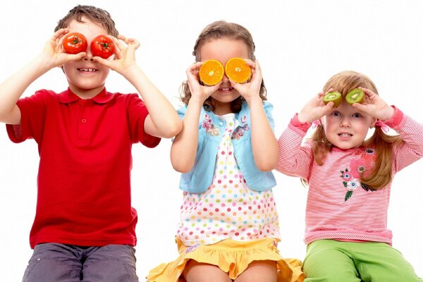 Children play with fruits and vegetables