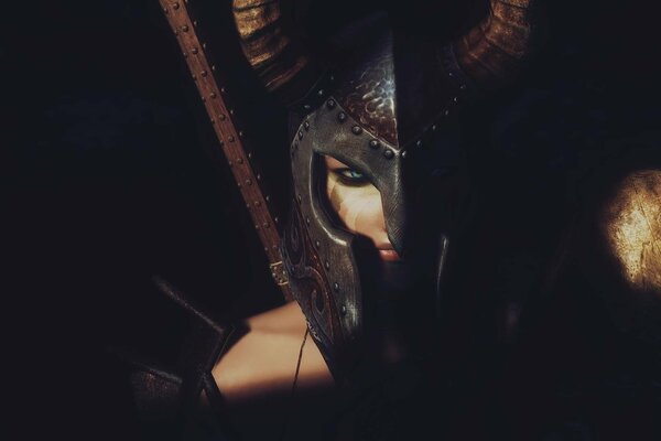 A warrior girl in a helmet on a black background