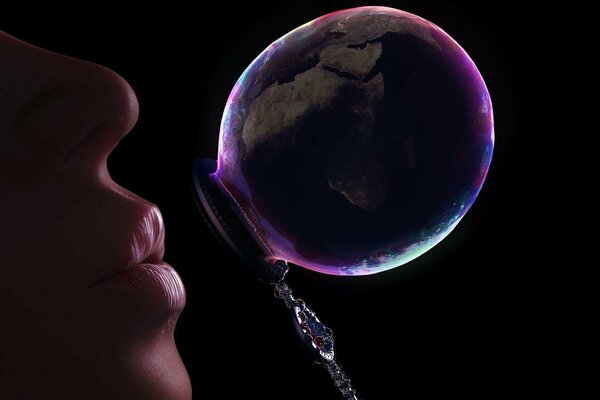 Lips inflate a bubble in the form of earth