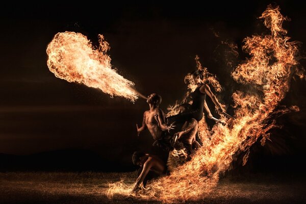 A group of people arranges a fire show