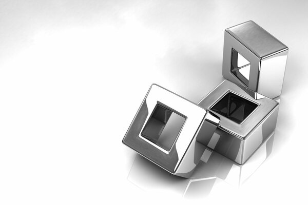 Argent cubes avec des trous sur fond blanc