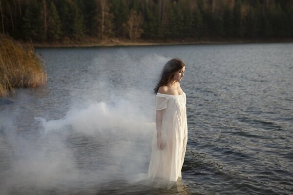 Photo session of a girl in a dress in the river