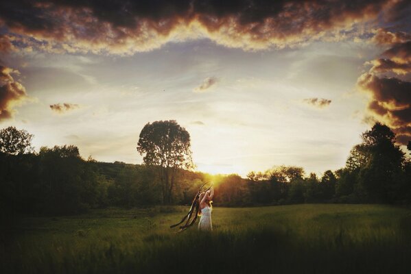 A girl in a sunny field