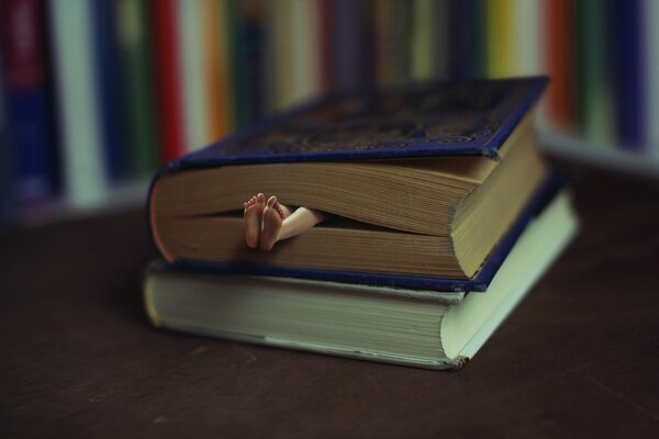 A man in the arms of a book of fairy tales