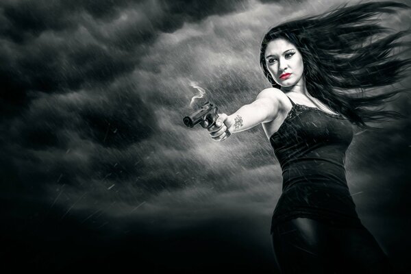 Model Romy from Sin City with a gun in her hands