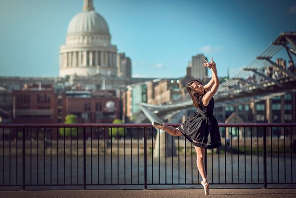 A ballerina on the background of the city of London, dancing a beautiful dance