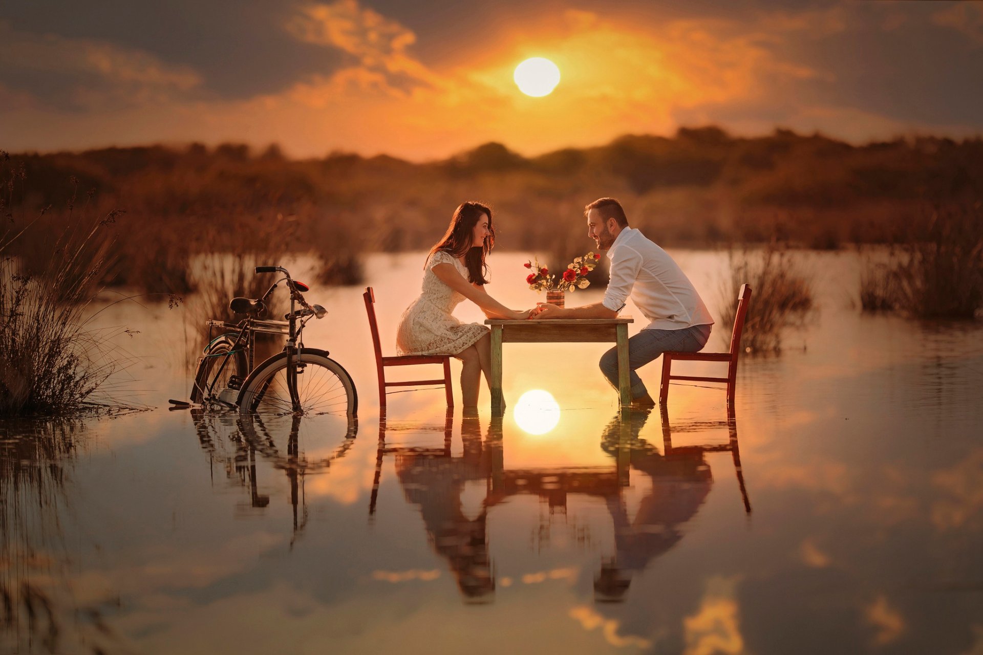 the pair romance conversation table bike water sun