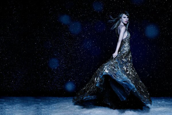 Taylor Swift in a beautiful dress on a dark background with highlights