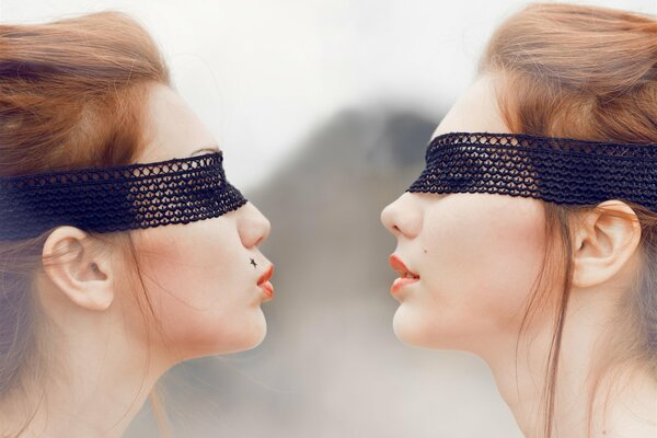 Photo of beautiful brown-haired women with blindfolds
