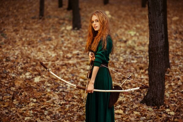 A red-haired archer in the autumn forest