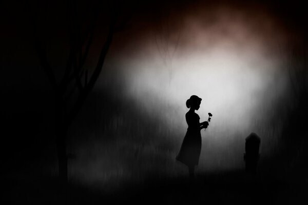 La nuit où la silhouette de la jeune fille est au-dessus d une pierre tombale