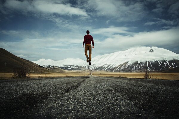 The guy is walking on the road to the sky