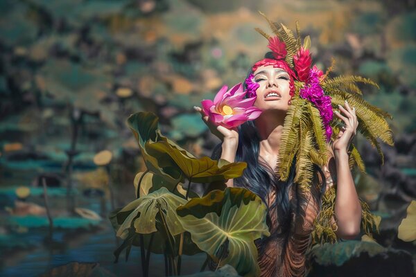 Beautiful girl in lotus flowers