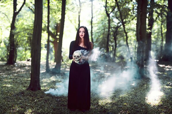 A witch in the forest with a skull