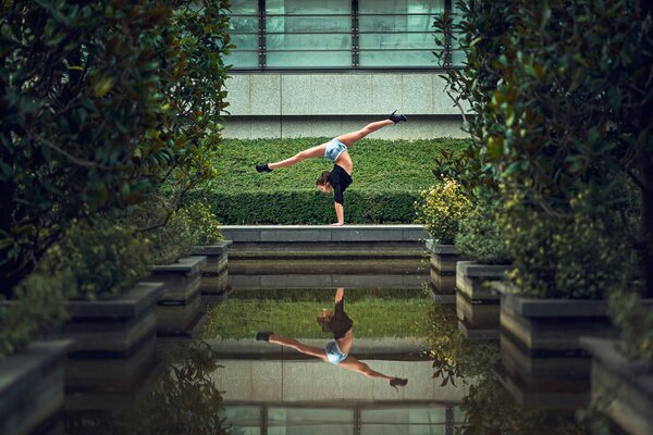 Photo of Samantha Ai dancing with a twine next to the water