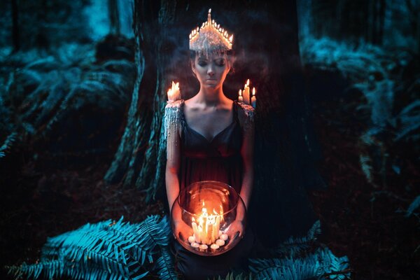 Mystical girl with a crown of candles