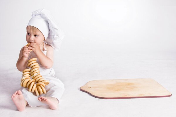 Children s photo shoot with bagels and kitchen uniforms