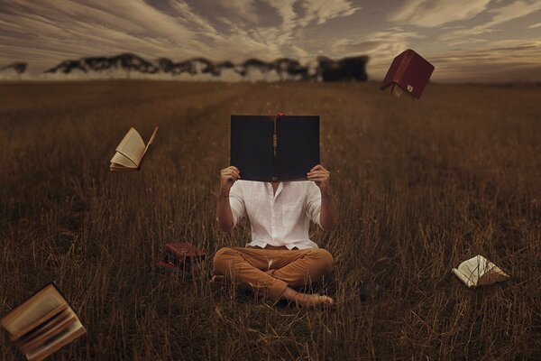 Flying books in the autumn field