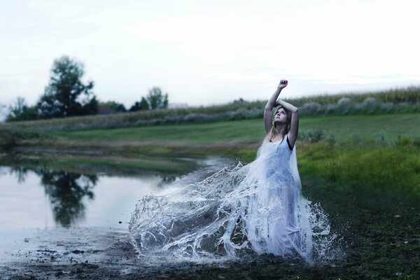 Beautiful girl with grouches in the water