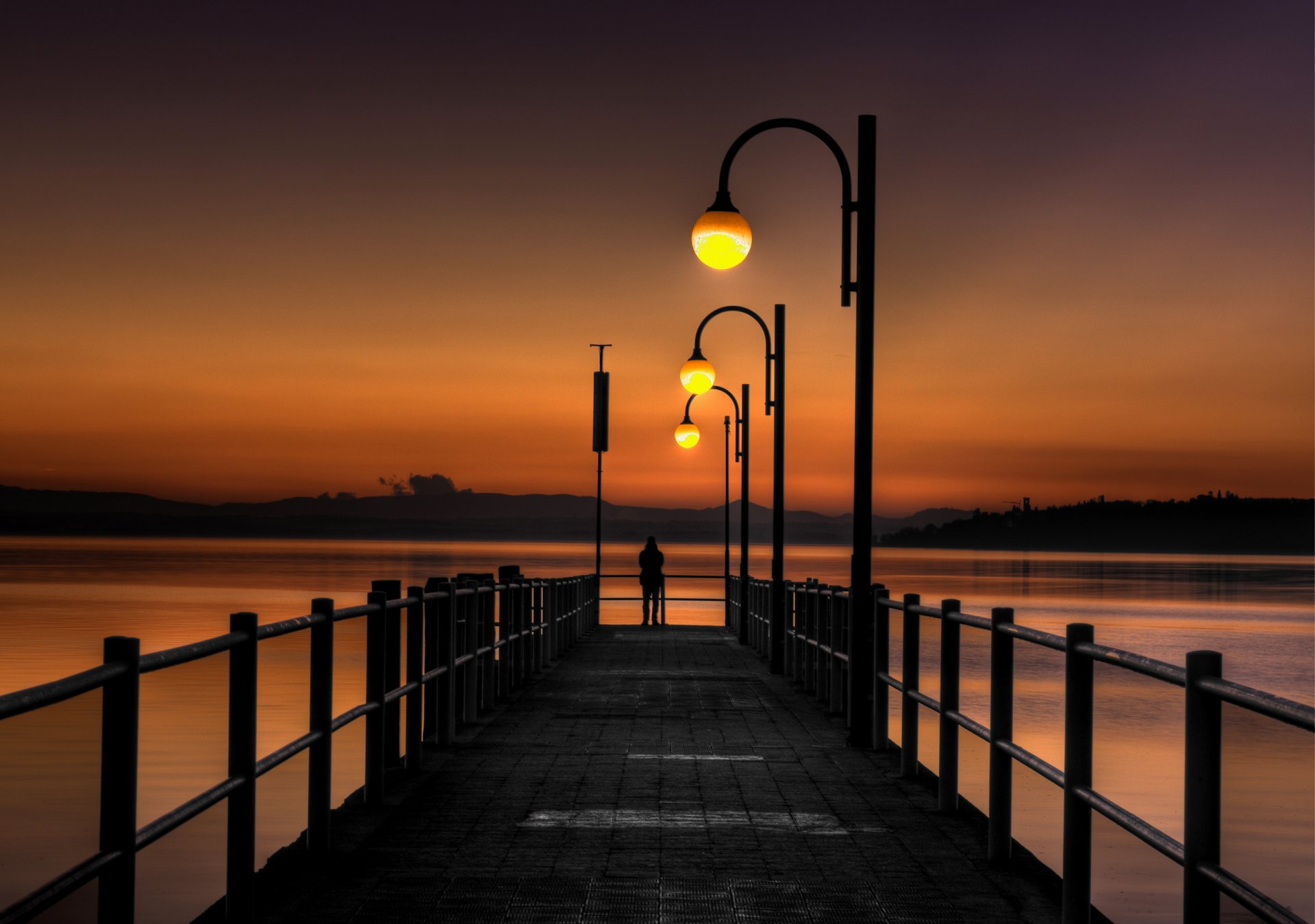 puesta de sol puente muelle mar luces