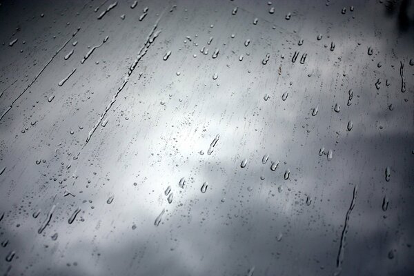 Rain behind the glass in black and white