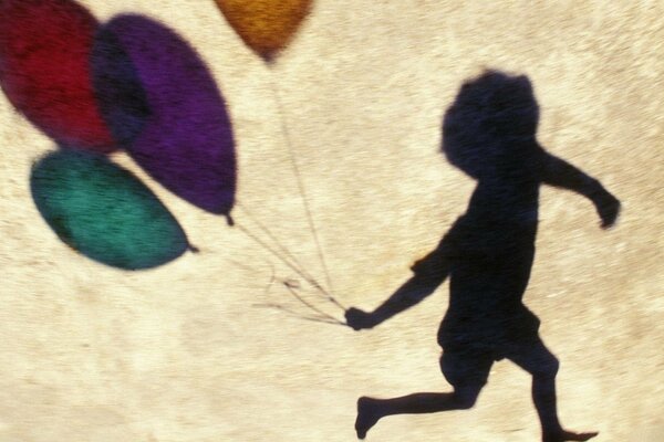 La sombra de un niño con globos