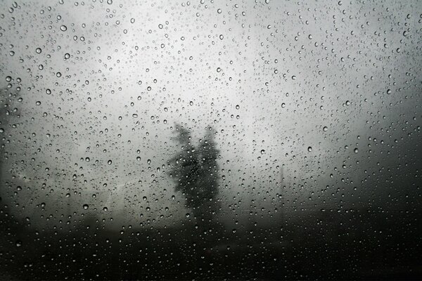 Raindrops on gray glass