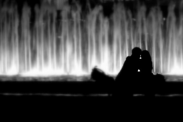 Black and white picture of a couple kissing