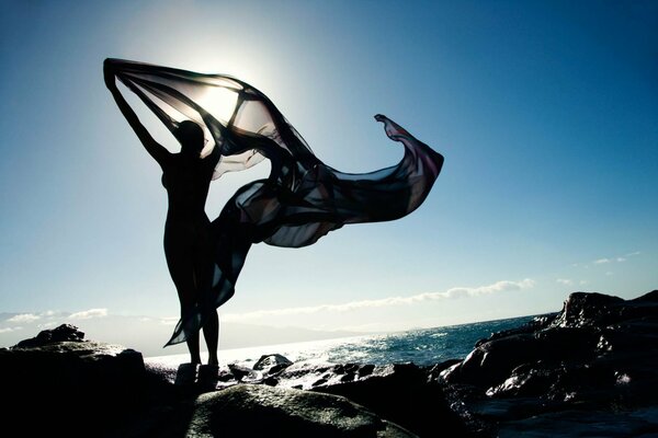 Photo of a girl in the arms of the wind