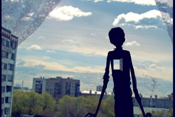 Figura oscura de un chico con una ventana en el lugar del corazón