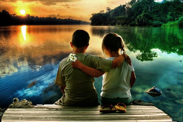 Sunset on the lake with children