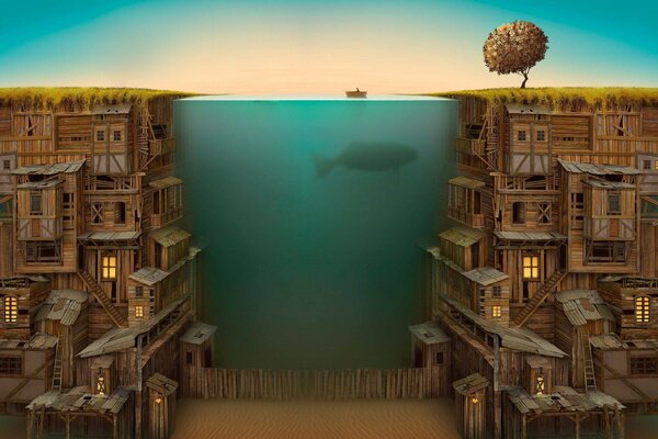 Whale underwater near wooden houses and lighted windows