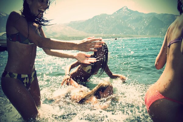 Their smiles in the light of the sea spray amuse, excite envy